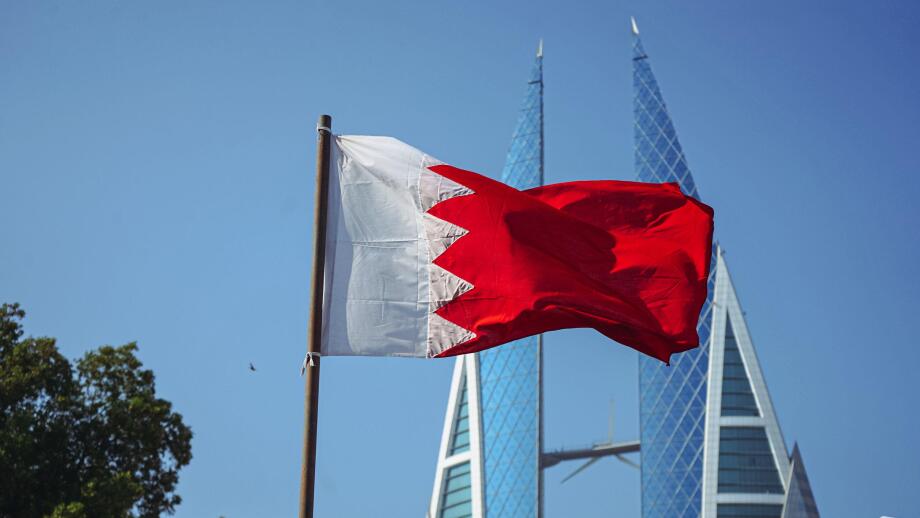 The national flag of Bahrain and Bahrain World Trade Centre.f