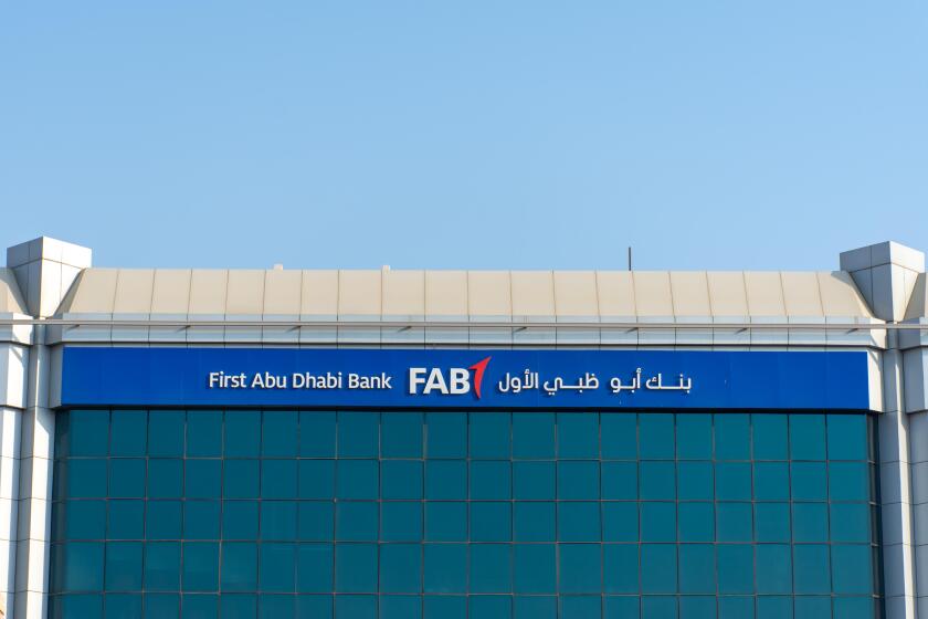 "Ras al Khaimah, Ras al Khaimah/United Arab Emirates - 10/11/2019: "First Abu Dhabi (FAB) Bank blue sign on a blue sky sunny day. "