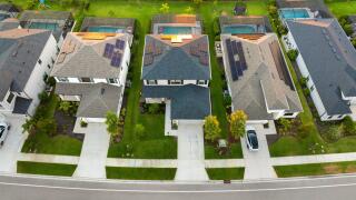 Wealthy neighborhood with expensive houses in southern Florida. Development of US premium housing market