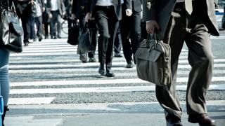 Low Section Of Business People Walking On Road
