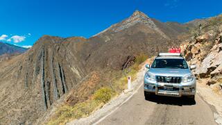 Toyota Landcruiser on a narrow road crossing the Cordillera Central of the Andes, Northern Peru, South America