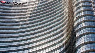 UniCredit Tower in the Porta Nuova District, Milan, Lombardy, Italy. Exterior view of curved glass facade of the tallest building in Italy.