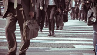 Low Section Of Business People Walking On Road