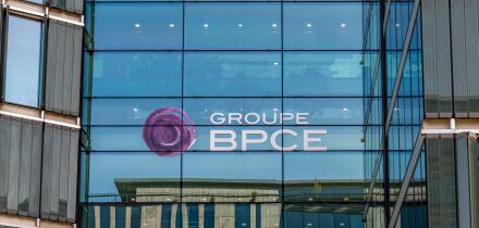 Sign on the facade of a building belonging to the French banking group BPCE, resulting from the merger of Banque Populaire and Caisse d'Epargne