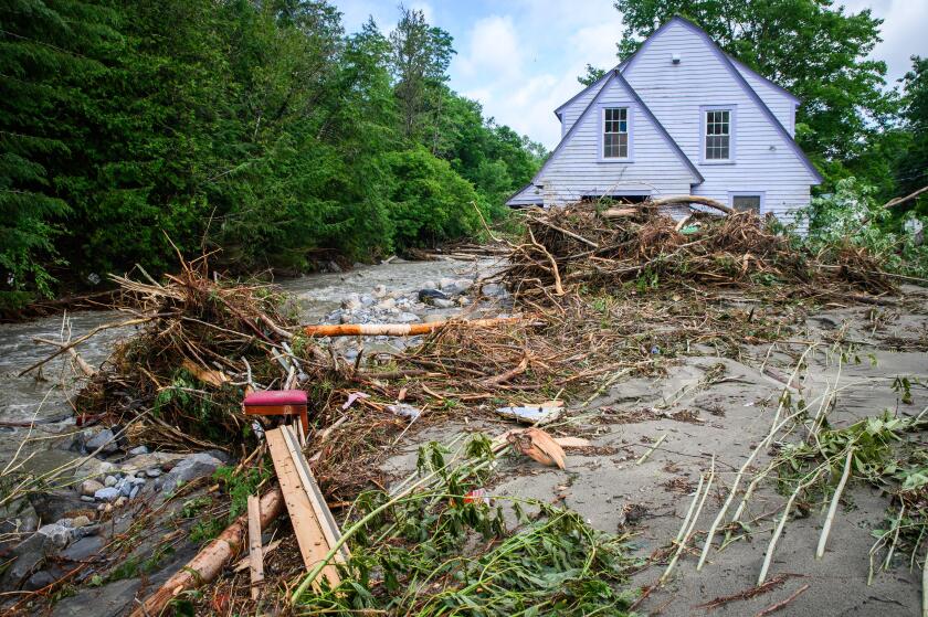Plainfield, Vermont, USA. 11 July, 2024. Flood debris surrounds a house on Brook Road in Plainfield, VT, USA, after torrential rains from the remnants of Hurricane Beryl hit central Vermont, USA. John Lazenby/Alamy Live News