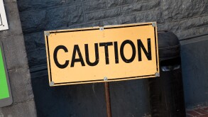 Yellow Caution sign close up