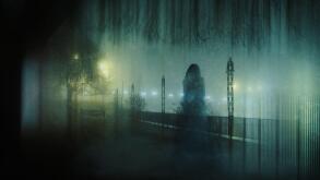 A ghostly transparent woman. Standing in a park. On an atmospheric winters night. With a grunge, blurred vintage edit.