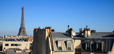 Eiffel Tower across roof tops in Paris, France