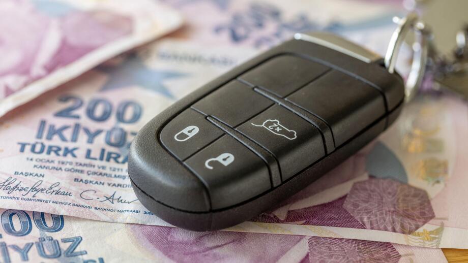 Car keys and Turkish lira. Business concept. Car insurance, Parking zone, transportation regulations, Leasing, Car loan, transportation costs, toll ro