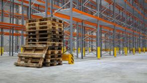 Empty stack pallets in logistics warehouse