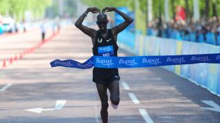Athletics - 2013 Bupa London 10k - London. Mo Farah crosses the line to win the Bupa London 10k run, London.