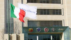 TURIN, ITALY - Jan 23, 2021: New Stellantis automotive corporation logo appear on plate and flags at italian headquarters Turin Italy January 23 2021
