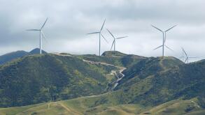 Wind power turbines on green hill near Wellington, New Zealand