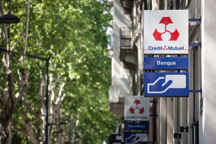 LYON, FRANCE - JULY 13, 2019: Credit Mutuel logo in front of their local bank in Lyon. Credit Mutuel is a cooperative bank, one of main french banks and insurance services