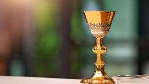Chalice on the altar in church and empty space for text