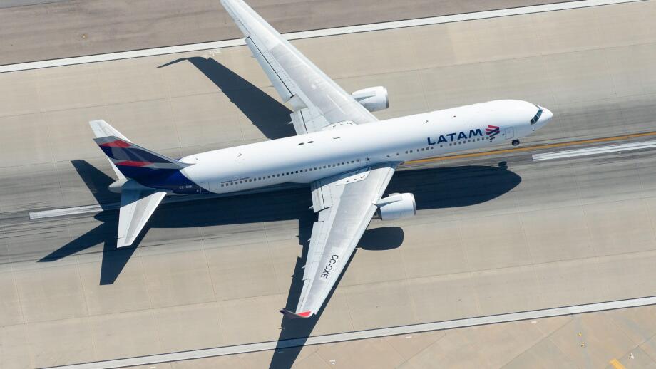 Aerial view of LATAM Airlines Boeing 767 CC-CXE departing LAX airport bound for Santiago (SCL), Chile. Widebody long haul aircraft seen from above.