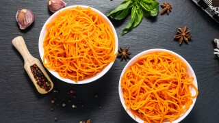 Two bowls of spicy aromatic Korean carrot salad-adobe-2022