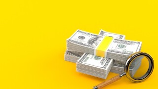 Dollar_search_magnifying_glass_Adobe_575x375_220120