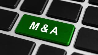 M&A or mergers and acquisitions green button on keyboard, business concept