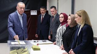 Istanbul, Turkey. 14th May, 2023. Turkish President Recep Tayyip Erdogan (1st L) casts his vote at a polling station in Istanbul, T¨¹rkiye, May 14, 2023. Turkish citizens headed to the polls on Sunday for twin presidential and parliamentary elections that