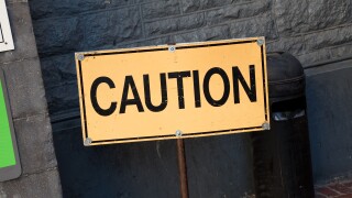 Yellow Caution sign close up