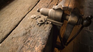 Vice fitted on old wooden bench