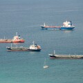 Cargo ships at anchor in front of Gibraltar