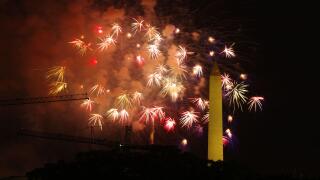 Independence Day fireworks explode behind the Washington Monument in Washington, DC, on July 4, 2023.