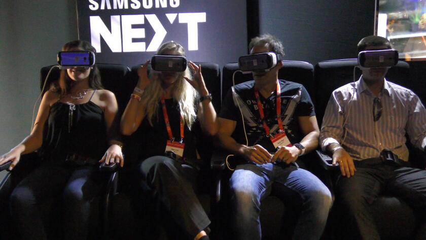 Celebrity Israeli Channel 10 award winning weather man Danny Roup (2nd from right) visiting Samsung Next VR station arcade during DLD Innovation Festival, Tel Aviv, Israel