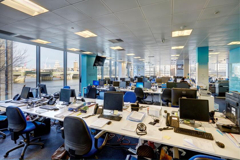 office desks terminals screen trading business city money empty trade exchange shares investment bank banking modern windows view london capital hedge