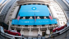 The New York Stock Exchange is decorated for the initial public offering of the car vending machine company Carvana on Friday, April 28, 2017. The Texas-based company sells used cars online where purchasers have the option of picking up their vehicle at a