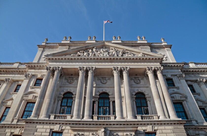 Looking up at the front facade of HM Treasury Building, Whitehall, London, UK.