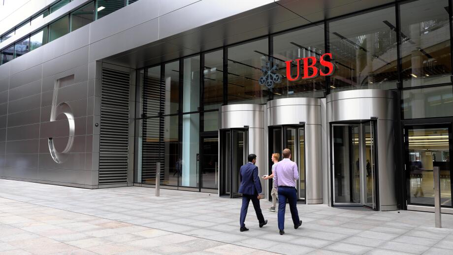 Entrance of 5 Broadgate UBS building exterior HQ headquarters sign people  financial services investment bank in the City of London UK   KATHY DEWITT