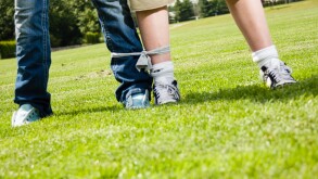 Boy and girl ready for a 3-legged race