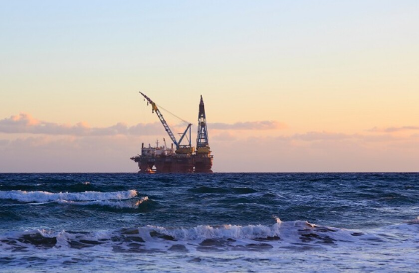 Saipem 7000 heavy semisubmersible floating crane moored off the coast of Larnaca Cyprus at sunset