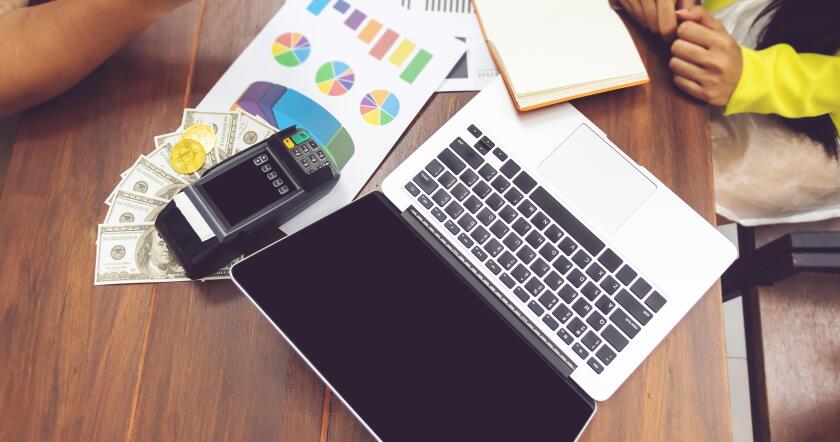 accounting concept. business people working with paper work. computer notebook and cash on table at office workplace