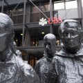 UBS headquarters at Broadgate, London, with the striking 'Rush Hour' sculpture by George Segal prominently displayed in the foreground, London, UK