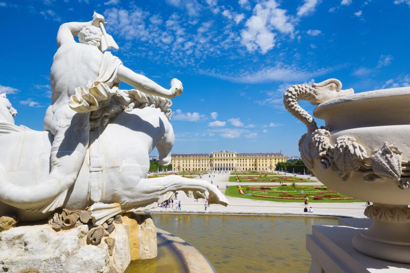 VIENNA, AUSTRIA - JULY 30, 2014: The Schonbrunn palace and gardens from Neptune fountain.