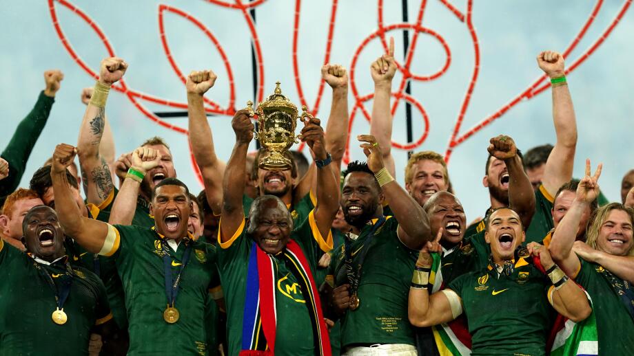 South African President Cyril Ramaphosa lifts the Webb Ellis Cup with the South Africa players following victory in the Rugby World Cup 2023 final match at the Stade de France in Paris, France. Picture date: Saturday October 28, 2023.