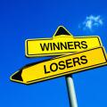 Winners or Losers - Traffic sign with two options - Competitive motivation to be successful and not lose game, match, play, duel and competition