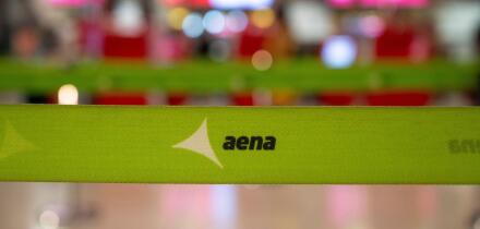Madrid, Spain. 10th Apr, 2025. The Aena logo, the state-owned airport service management company, is visible on a barrier tape in the departure hall of Adolfo Suarez Madrid-Barajas Terminal 4 in Spain. (Photo by Xavi Lopez/SOPA Images/Sipa USA) Credit: Si