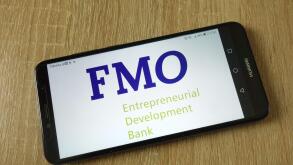 Netherlands Development Finance Company (FMO) logo displayed on smartphone