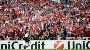 Inter Milan forward Diego Milito celebrates scoring as he runs past Bayern Munich fans during the Champions League final soccer match between Bayern Munich and Inter Milan at the Santiago Bernabeu stadium in Madrid, Saturday May 22, 2010. (AP Photo/Daniel