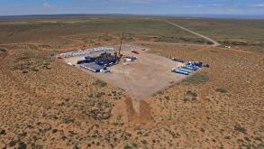 Vaca Muerta, Argentina, December 2, 2014: Extraction of unconventional oil. Battery of pumping trucks for hydraulic fracturing (Fracking).