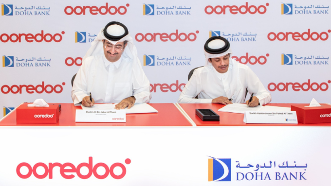 Senior representatives of Doha Bank and Ooredoo sign a Memorandum of Understanding to 