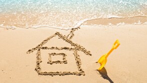 drawing of a house on the beach - concept safety and vacation