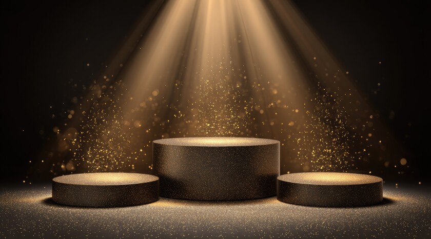 Dark, elegant podiums illuminated by golden spotlight