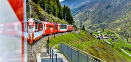 Zermatt 24,5,2023: Glacier Express red swiss train in Swiss Alps.Zermatt to St.Moritz. Switzerland in summer