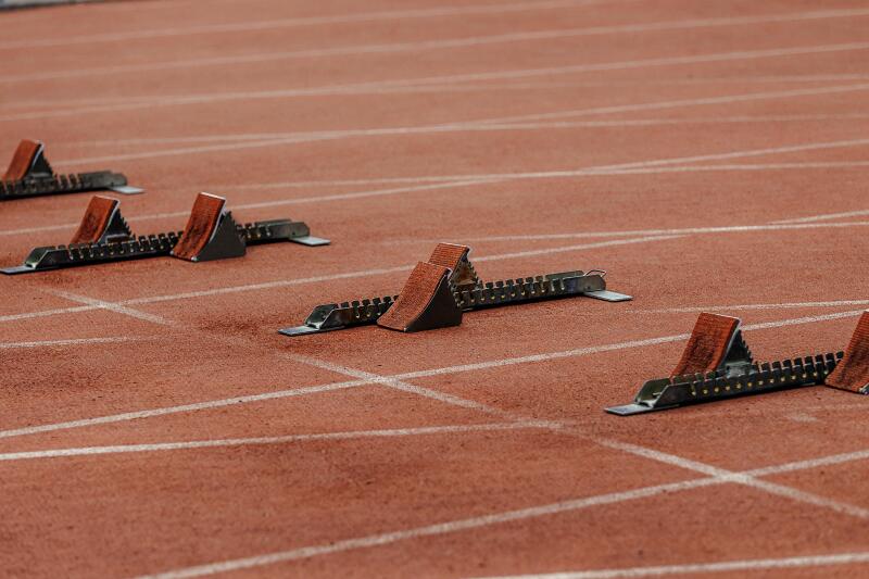 starting blocks on start line of running track stadium
