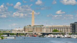 Washington DC, USA - 3 May 2024: Wide view of the Wharf marina on the Potomac River in Washington DC. In the background is the Washington Monument
